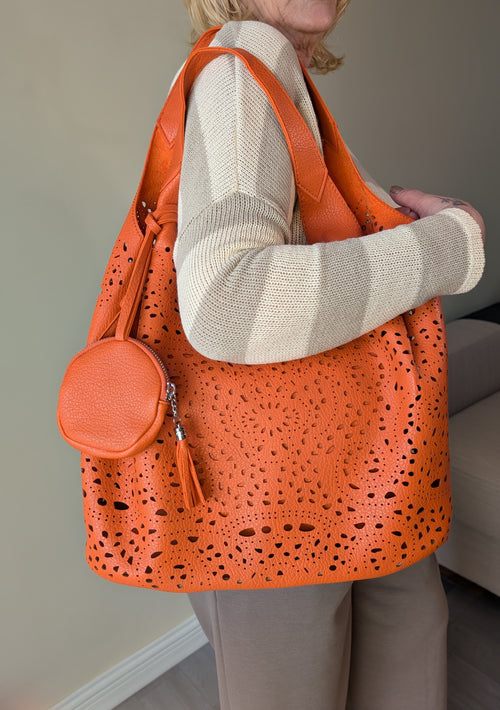 Bolso shopper naranja calado con monedero redondo a juego